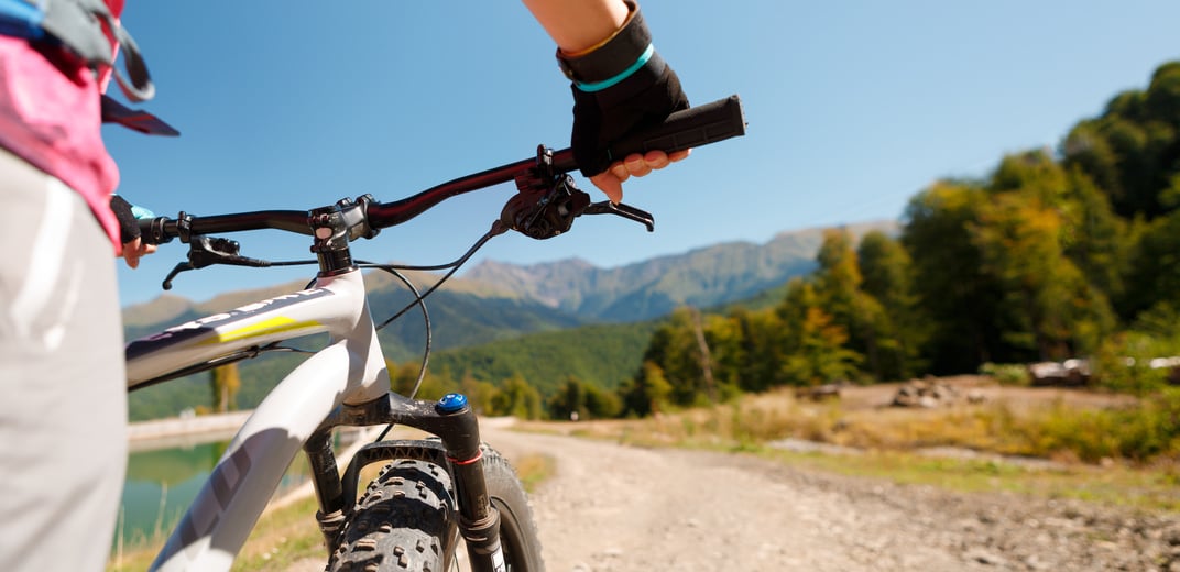 Photo of Girl Wearing Gloves on Mountain Bike